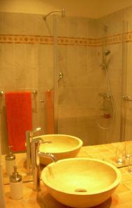 a bathroom with two sinks and a shower at Capitole Bleu in Nice