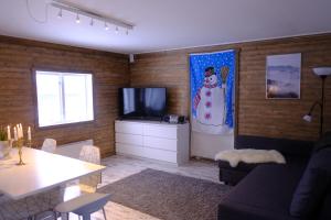 a living room with a snowman mural on the wall at Åre Kläppen in Åre