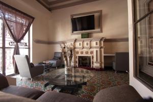 TV a/nebo společenská místnost v ubytování Casa de Juan Hostal