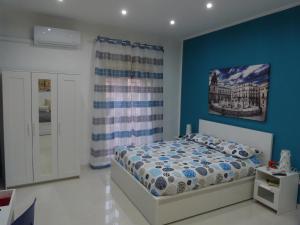 A bed or beds in a room at Casa Principe Maqueda