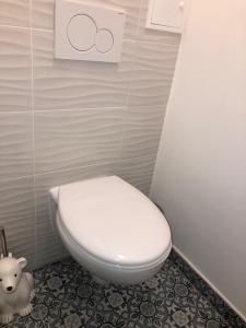 a bathroom with a white toilet in a stall at Flair and Design Apartment! in Vienna