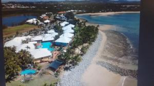an aerial view of a resort on the beach at Apartment in Dolphin Heads in Eimeo