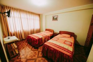 Postel nebo postele na pokoji v ubytování Hotel Las Viñas