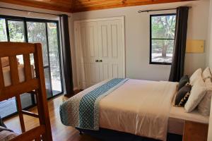 Katil atau katil-katil dalam bilik di Ellensbrook Cottages
