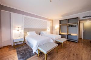 Voodi või voodid majutusasutuse Bisinii Boutique Hotel toas