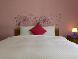 Posteľ alebo postele v izbe v ubytovaní Hengchun Inn