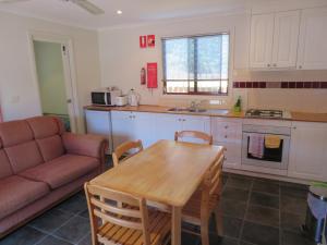 A kitchen or kitchenette at Latrobe Mersey River Cabin and Caravan Park