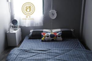 Llit o llits en una habitació de Hong hostel