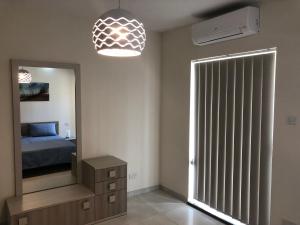 A bed or beds in a room at Marsascala Sea View Apartment HPI 7738