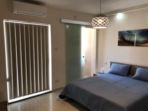 A bed or beds in a room at Marsascala Sea View Apartment HPI 7738