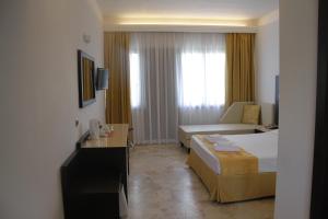 Postel nebo postele na pokoji v ubytování Hotel Boomerang Roma