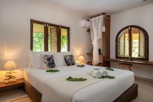 Postelja oz. postelje v sobi nastanitve Bliss Hotel Praslin