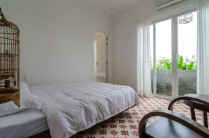 מיטה או מיטות בחדר ב-IAMSAIGON homestay