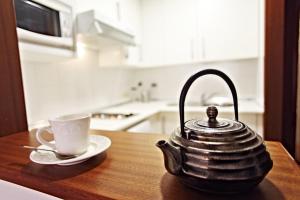 A kitchen or kitchenette at Apartamentos Vértice Bib Rambla