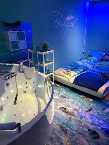 a bedroom with a bath tub and a bed at AquaFlat in Budapest