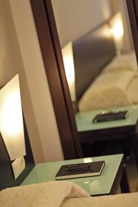A bed or beds in a room at Apartamentos Vértice Bib Rambla