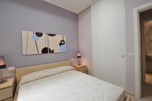 A bed or beds in a room at Foresteria Pellegrino