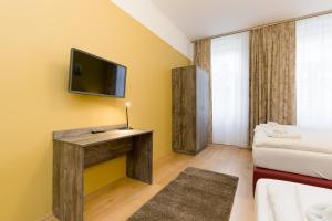 Telewizja i/lub zestaw kina domowego w obiekcie Vienna Stay Apartments Pezzl 1170