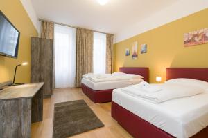 Łóżko lub łóżka w pokoju w obiekcie Vienna Stay Apartments Pezzl 1170