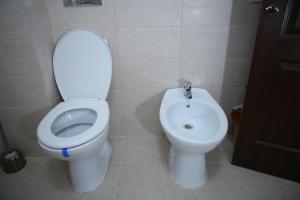a bathroom with a toilet and a bidet at RCC2 in Focşani