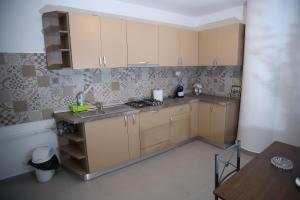 a small kitchen with a sink and a stove at RCC2 in Focşani