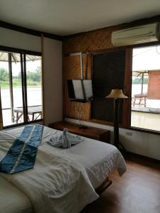 Llit o llits en una habitació de River Marina Resort