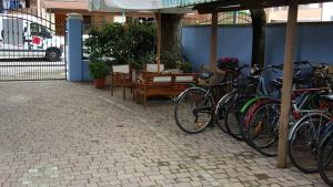 a group of bikes parked under an umbrella at B&B Anny in Porto Garibaldi