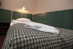 Postel nebo postele na pokoji v ubytování Hotell Älvdalen