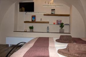Posteľ alebo postele v izbe v ubytovaní Apartmán U Gotického dvojčete