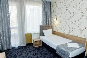 Cama o camas de una habitación en Family Hotel Prestige