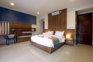 Katil atau katil-katil dalam bilik di Villa Luna Kuta Lombok