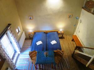 a room with a bed in the middle of a room at Medieval Apartments Frauendorf in Axente Sever