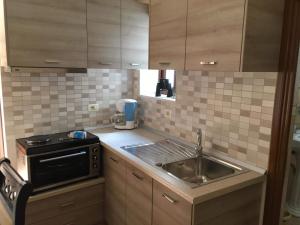 Η κουζίνα ή μικρή κουζίνα στο Romeo's Guest House +18 φωτογραφίες