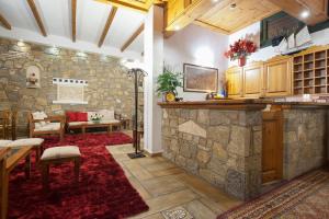 A kitchen or kitchenette at Artemis Hotel