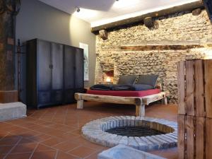 a bedroom with a bed and a fire pit at Brunnenschmiede in Konstanz