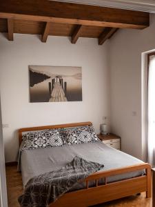 a bedroom with a bed and a bridge at Cà del Garì in Tremosine Sul Garda