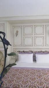 a bedroom with a bed with a large headboard at Losta Sahil Evi 2 in Selimiye