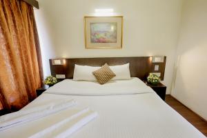 Letto o letti in una camera di The Byke Old Anchor Beach Resort & Spa