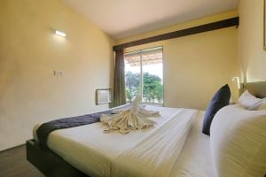 Letto o letti in una camera di The Byke Old Anchor Beach Resort & Spa