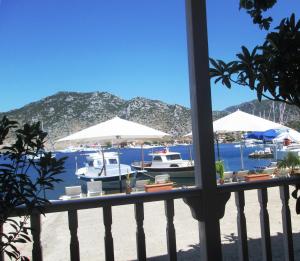a view of a beach with boats in the water at Losta Sahil Evi 2 in Selimiye