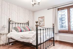 Ένα ή περισσότερα κρεβάτια σε δωμάτιο στο Apartment Balmat - Chamonix All Year