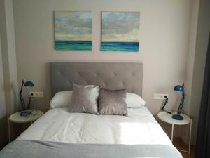 Кровать или кровати в номере Apartamentos Prestin