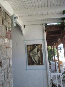 a picture of a fish on the side of a building at Losta Sahil Evi 2 in Selimiye
