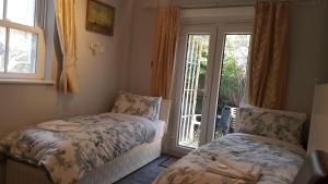 Postel nebo postele na pokoji v ubytování Oakley Hotel