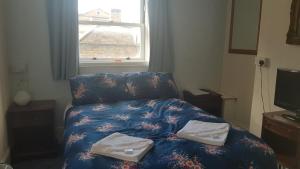 Postel nebo postele na pokoji v ubytování Oakley Hotel