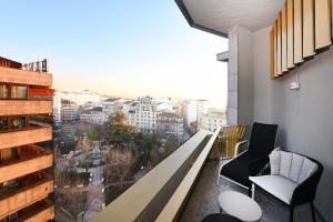 a room with a large window with a view of a city at Barceló Ourense in Ourense