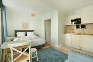 Køkken eller tekøkken på Résidence Grands Boulevards by Studio prestige