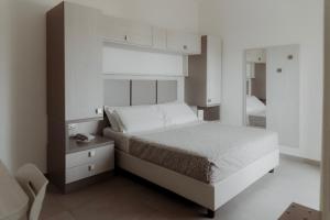 Postel nebo postele na pokoji v ubytování Hotel Caravel