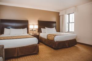 A bed or beds in a room at Chicago South Loop Hotel
