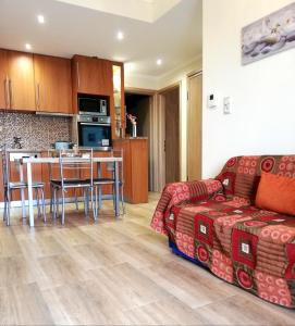 a living room with a couch and a table at Aspa's Apartment in Kavála